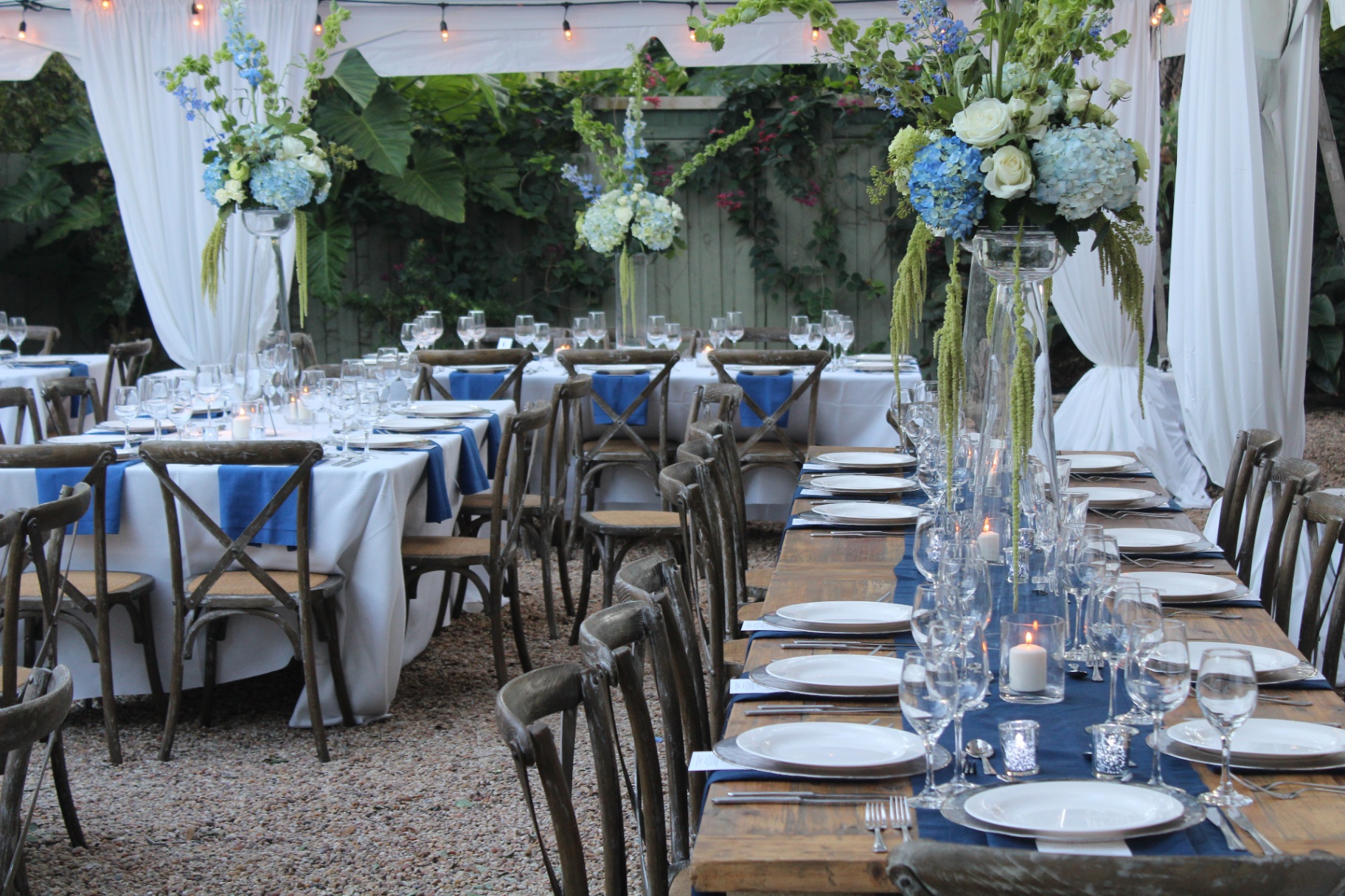 Garden dinner setting at a Miami venue catered by MG Culinary Concepts